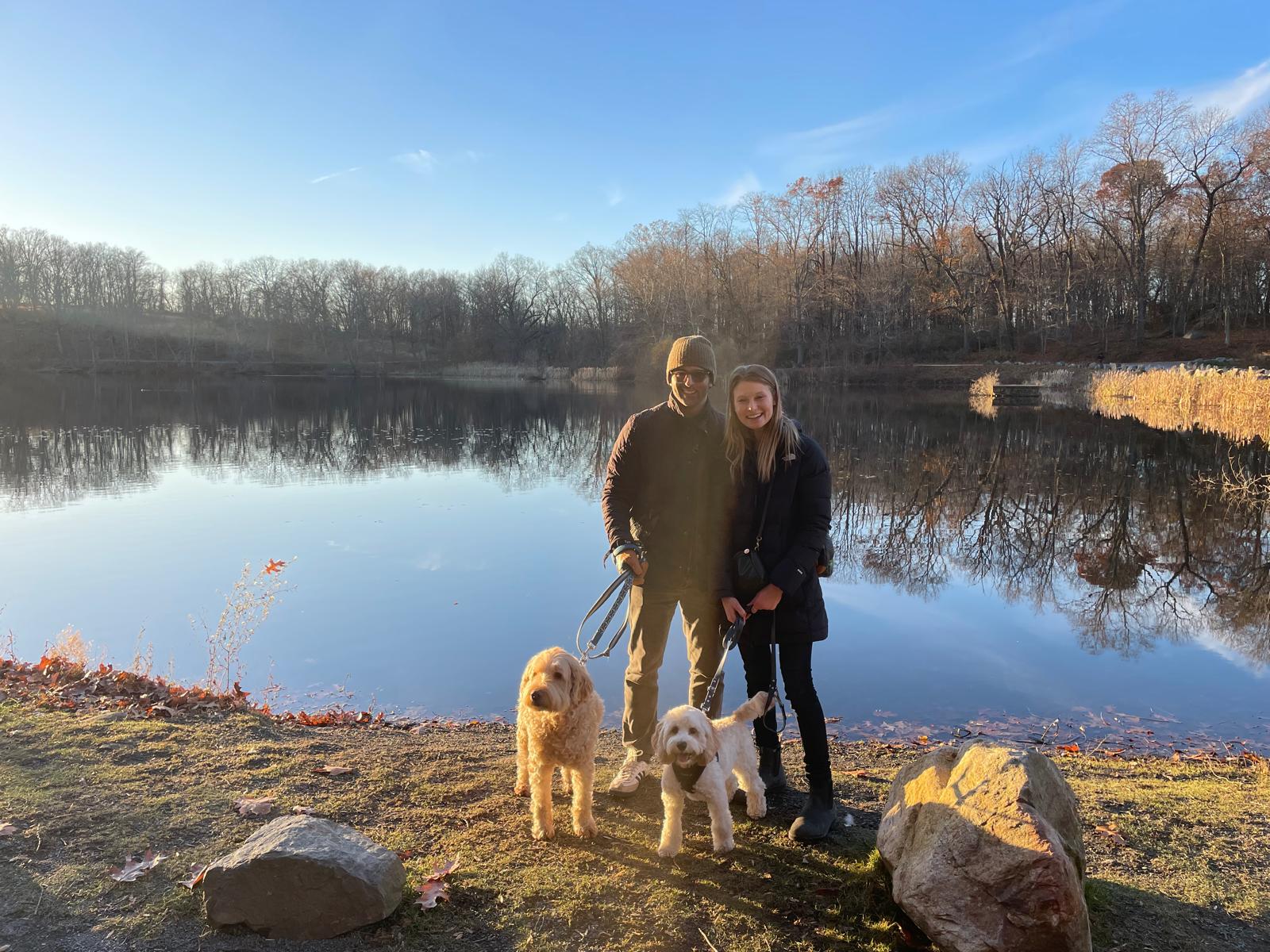 Eliza and Dan by the lake with dogs